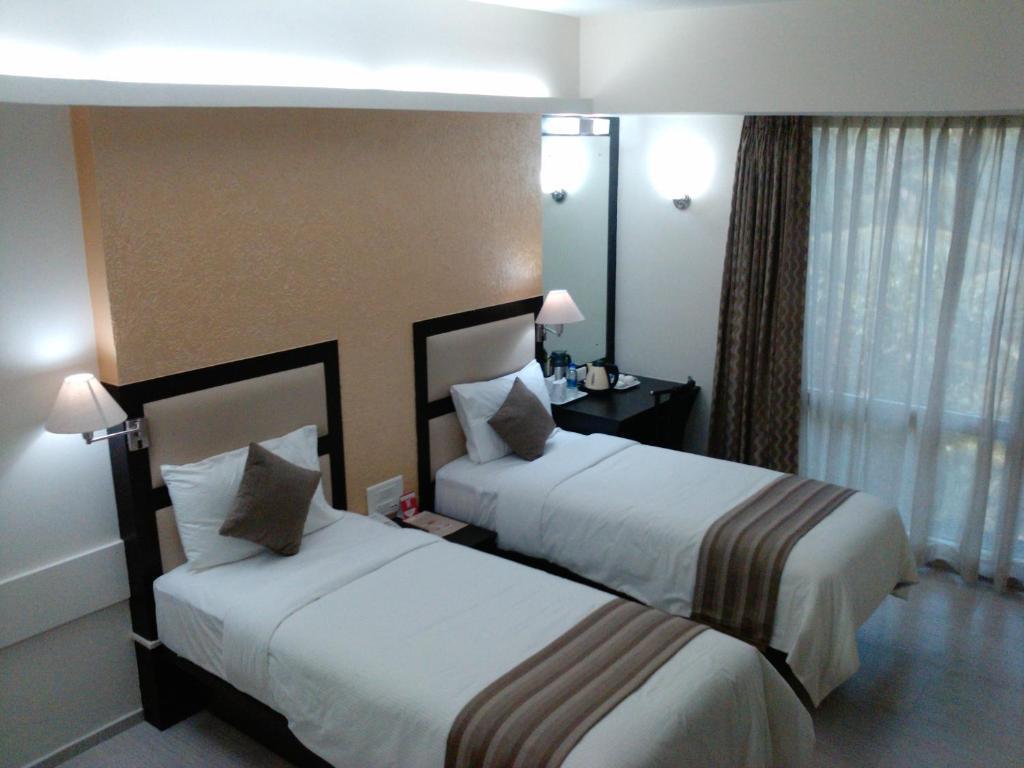 Pattom Royal Hotel Thiruvananthapuram Rom bilde